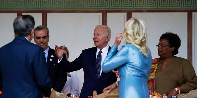 President Joe Biden speaks with guests as he and first lady Jill Biden host a dinner during the Summit of the Americas, Thursday, June 9, 2022, in Los Angeles. (AP Photo/Evan Vucci)