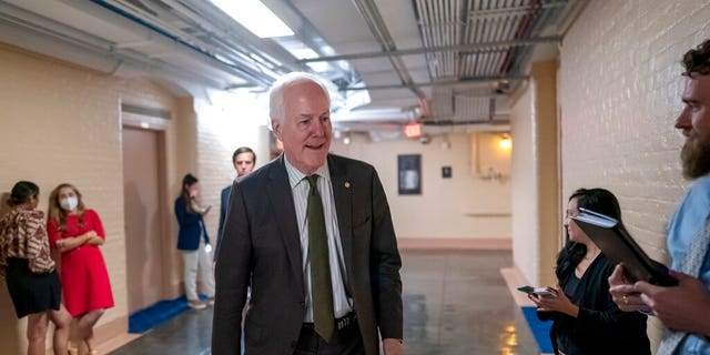 Sen. John Cornyn, R-Texas, arrives to meet with Sen. Chris Murphy, D-Conn., and Sen. Kyrsten Sinema, D-Ariz., arrive for more bipartisan talks on how to rein in gun violence, at the Capitol in Washington, Wednesday, June 15, 2022. The bill is set to pass the Senate this week. 