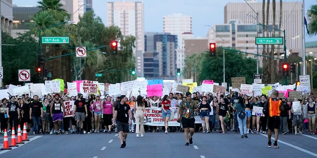 Thousands of protesters march around the Arizona Capitol after the Supreme Court decision to overturn the landmark Roe v. Wade abortion decision Friday, June 24, 2022, in Phoenix. 