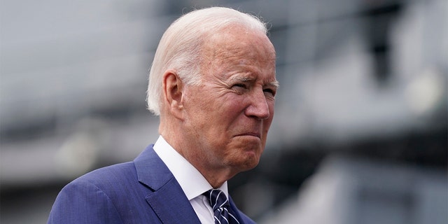 President Biden waits before giving remarks on inflation and supply chain issues at the Port of Los Angeles, Friday, June 10, 2022, in Los Angeles.