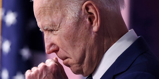 President Biden clears his throat as he announces new steps requiring the government to buy American-made goods during remarks March 4, 2022. 