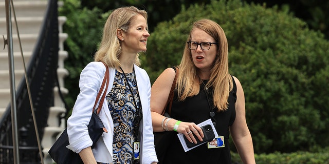 White House Counsel Dana Remus (L) and Deputy Chief of Staff Jennifer O'Malley Dillon depart the White House on July 13, 2021, in Washington, DC.