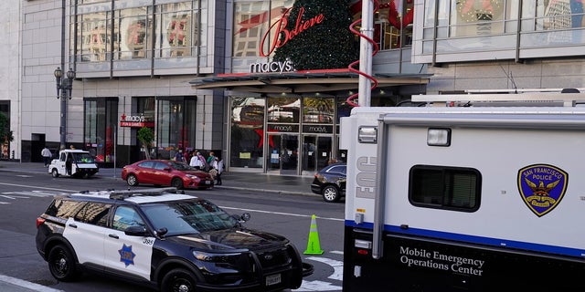 Police vehicles stationed at Union Square following a spate of robberies in San Francisco on Dec. 2, 2021. 