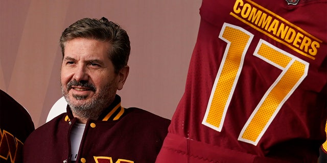 FILE: Dan Snyder, co-owner and co-CEO of the Washington Commanders, poses for photos during an event to unveil the NFL football team's new identity, Wednesday, Feb. 2, 2022, in Landover, Md.
