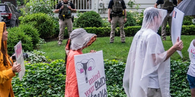 CHEVY CHASE, MD: Protesters march past Supreme Court Justice Brett Kavanaugh's home. 