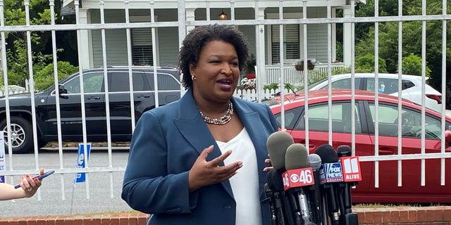 Democratic gubernatorial candidate Stacey Abrams speaks to reporters on primary day in Georgia, on May 24, 2022. 