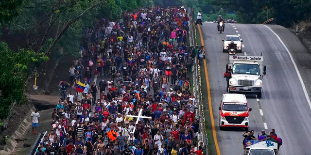 June 7, 2022: Migrants, many from Central American and Venezuela, walk along the Huehuetan highway in Chiapas state, Mexico. (AP Photo/Marco Ugarte)