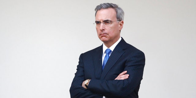 FILE: White House counsel Pat Cipollone listens as President Donald Trump speaks during a coronavirus task force briefing in the Rose Garden of the White House, March 29, 2020, in Washington. 