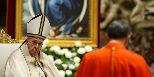 Pope Francis attends a consistory ceremony where 13 bishops were elevated to a cardinal's rank in St. Peter’s Basilica at the Vatican, Saturday, Nov. 28, 2020. (Fabio Frustaci/POOL via AP)