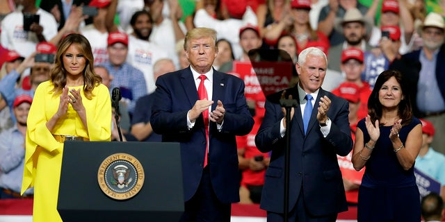First lady Melania Trump, President Donald Trump, Vice President Mike Pence and Karen Pence greet supporters at a rally where Trump formally announced his 2020 re-election bid Tuesday, June 18, 2019, in Orlando, Fla. (AP Photo/John Raoux)