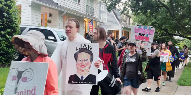 A group of drummers marched outside of Kavanaugh's house after an alleged assassination attempt.