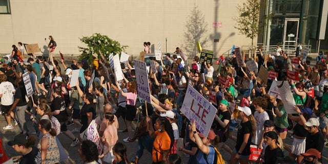 People march to protest the Supreme Court's decision in the Dobbs v Jackson Women's Health case on June 24, 2022 in Atlanta, Georgia. 