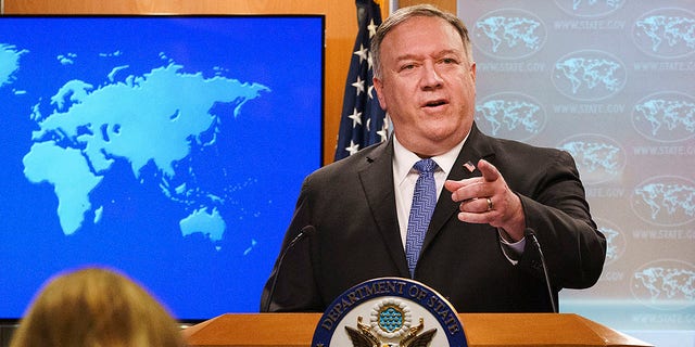 Secretary of State Mike Pompeo gestures toward a reporter while speaking about the counting of votes in the U.S. election during a briefing to the media, Tuesday, Nov. 10, 2020, at the State Department in Washington. (AP Photo/Jacquelyn Martin, Pool)