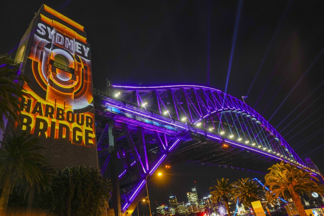The Sydney Harbour Bridge is illuminated in " Royal Purple" to mark the 70th anniversary of the coronation of Queen Elizabeth II, in Sydney, Australia, on Thursday.