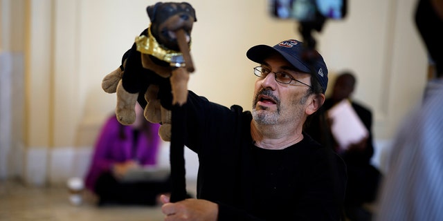 WASHINGTON, DC - JUNE 16: Actor and comedian Robert Smigel performs as Triumph the Insult Comic Dog in the hallways outside the House Select Committee to Investigate the January 6th Attack on the U.S. Capitol hearing in the Cannon House Office Building on June 16, 2022 in Washington, DC.