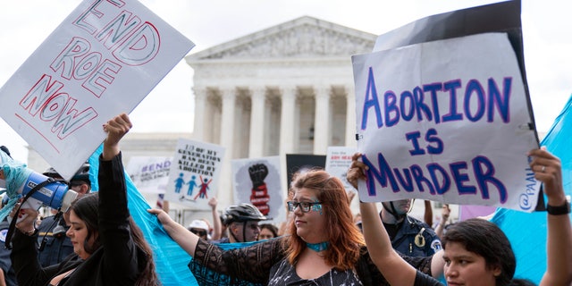 Pro-life protesters gather outside the Supreme Court in Washington, Friday, June 24, 2022. (AP Photo/Jose Luis Magana)