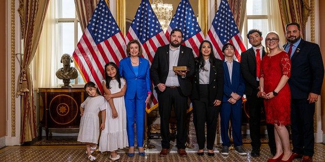 WASHINGTON, DC - JUNE 21: Congresswoman-elect Mayra Flores (R-TX) stands with her family and Speaker of the House Nancy Pelosi (D-CA) for a portrait after being sworn-in on June 21, 2022 in Washington, DC. (Photo by Brandon Bell/Getty Images)