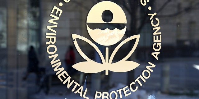 The U.S. Environmental Protection Agency's (EPA) logo is displayed on a door at its headquarters on March 16, 2017 in Washington, DC. U.S. President Donald Trump's proposed budget for 2018 seeks to cut the EPA's budget by 31 percent from $8.1 billion to $5.7 billion.  