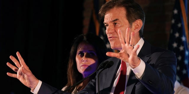 Mehmet Oz, a Republican candidate for U.S. Senate in Pennsylvania, waves to supporters at a primary night election gathering in Newtown, Pa., Tuesday, May 17, 2022.