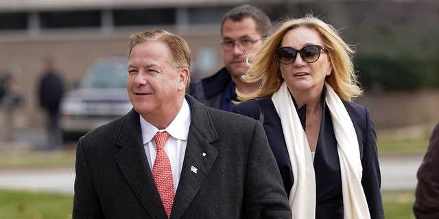 FILE - Mark McCloskey, a Republican candidate for U.S. Senate in Missouri, and his wife, Patricia McCloskey, walk outside the Kenosha County Courthouse, Tuesday, Nov. 16, 2021, in Kenosha, Wisconsin.