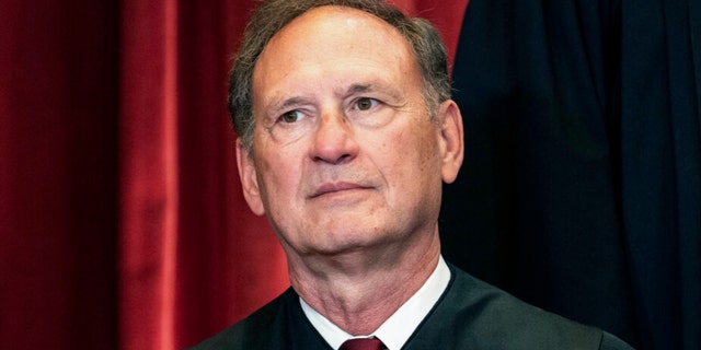 FILE - Associate Justice Samuel Alito sits during a group photo at the Supreme Court in Washington, April 23, 2021. The Supreme Court has ended constitutional protections for abortion that had been in place nearly 50 years — a decision by its conservative majority to overturn the court's landmark abortion cases. 