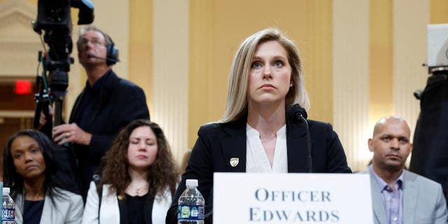 U.S. Capitol Police Officer Caroline Edwards testifies before the U.S. House Select Committee to Investigate the January 6 Attack on the United States Capitol with Sandra Garza, partner of Brian Sicknick, and U.S. Capitol Police Officer Sgt. Aquilino Gonell in the back, on Capitol Hill in Washington, U.S., June 9, 2022. 