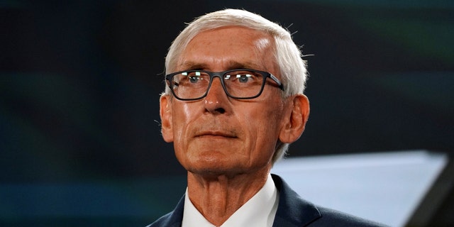 Wisconsin Governor Tony Evers waits to speak on the third day of the Democratic National Convention at the Wisconsin Center in Milwaukee, Wisconsin August 19, 2020. 