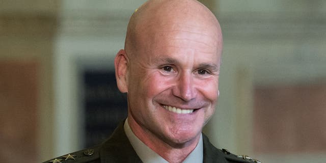 Christopher G. Cavoli, U.S. Army general, smiles as he is awarded the Bavarian Order of Merit by the Bavarian Minister-President.