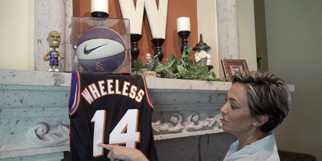 Wheeless shows off Phoenix Suns memorabilia from her time with the NBA team.