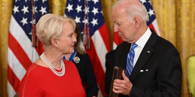 President Biden presents Cindy McCain, the widow of former Senator and presidential candidate John McCain, posthumously with the Presidential Medal of Freedom, the nation's highest civilian honor, during a ceremony honoring 17 recipients, in the East Room of the White House in Washington, D.C., July 7, 2022.