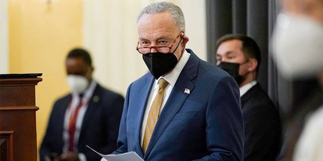 Senate Majority Leader Chuck Schumer, D-N.Y., waits to speak during an event to mark one year since the U.S. Capitol insurrection on Capitol Hill in Washington on Jan. 6, 2022.