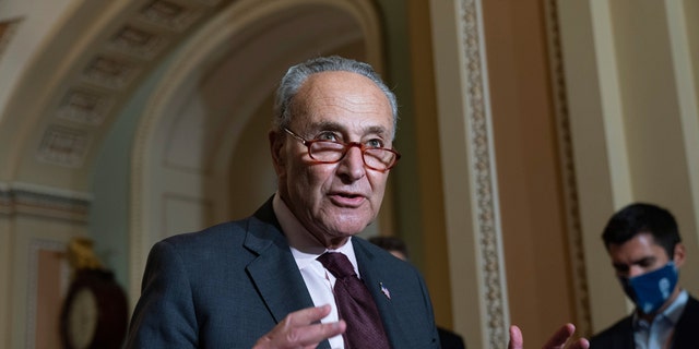 Senate Majority Leader Chuck Schumer of New York speaks to the media Oct. 19, 2021, in Washington. 