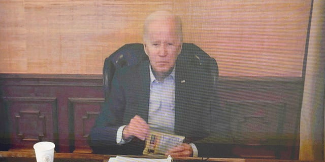 President Biden virtually attends a meeting with his economic team in the South Court Auditorium on the White House complex in Washington, on Friday.
