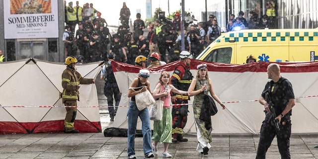 People leave the Field's shopping center in Copenhagen, Denmark Sunday, July 3, 2022.