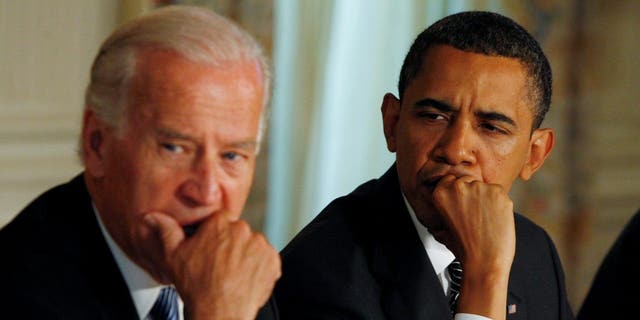 Former-President Barack Obama and then-Vice President Joe Biden participate in a cabinet meeting at the White House in Washington, U.S., June 8, 2009.    REUTERS/Jason Reed/File Photo