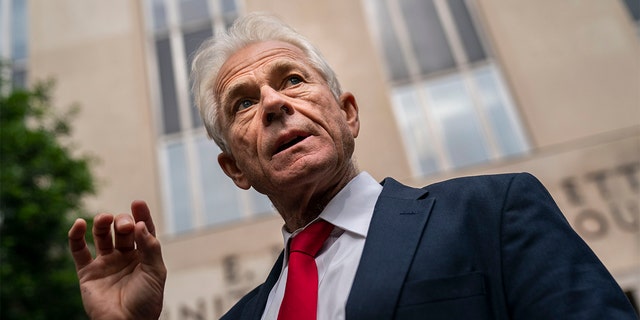 Former Trump White House adviser Peter Navarro speaks to the media outside U.S. District Court.