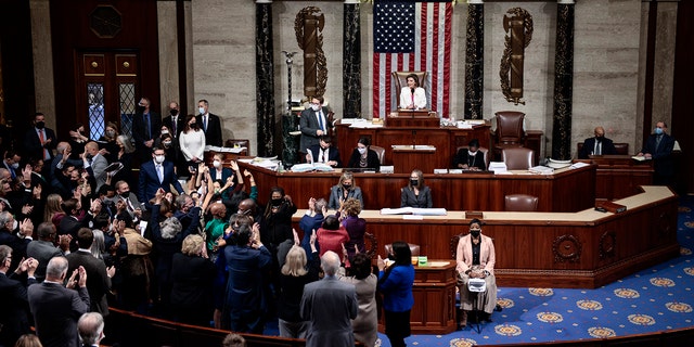 WASHINGTON, DC - NOVEMBER 19: Speaker of the House Nancy Pelosi (D-CA) looks on House Democrats at the U.S. Capitol on November 19, 2021 in Washington, DC. 