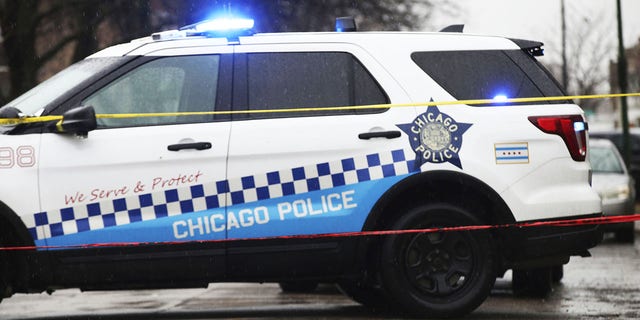 Bullet casings litter the street as police investigate the scene of a shooting on West Congress Parkway in Chicago, Tuesday, Feb. 22, 2022.