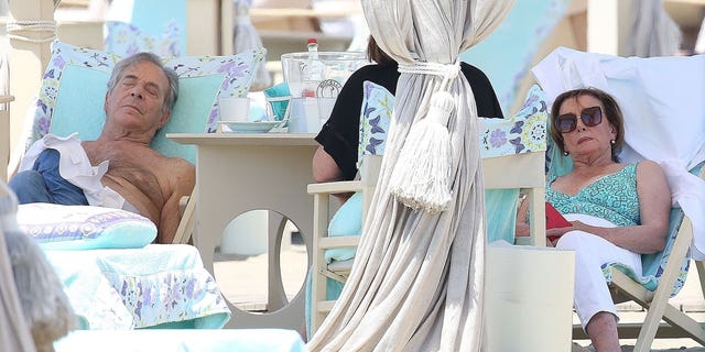 House Speaker Nancy Pelosi, D-Calif., and husband Paul Pelosi rest on a beach in Italy over Independence Day weekend.