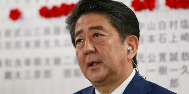 Japanese Prime Minister Shinzo Abe, leader of the Liberal Democratic Party, answers questions from a reporter during a TV interview in Tokyo Oct. 22, 2017.