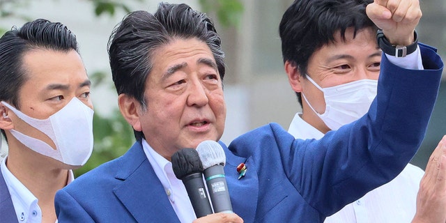 Former Japanese Prime Minister Shinzo Abe delivering a campaign speech for the ruling Liberal Democratic Party (LDP) candidate Keiichiro Asao for the Upper House election in Yokohama, suburban Tokyo, on July 6. 