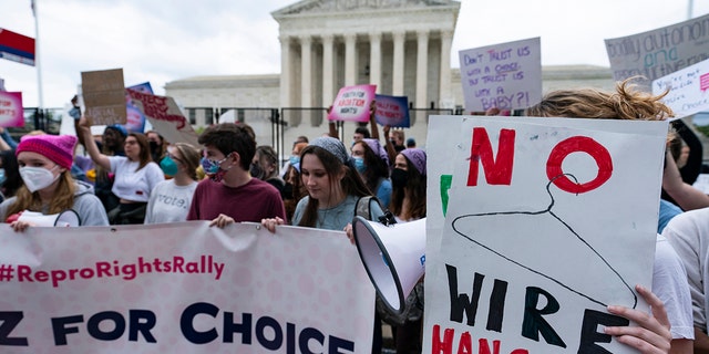 Demonstrators protest outside of the U.S. Supreme Court in Washington on May 5, 2022.