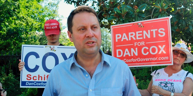 Del. Dan Cox, a Maryland state legislator who is seeking the Republican nomination for governor of Maryland, talks to reporters, in Annapolis, Md., June 30, 2022.