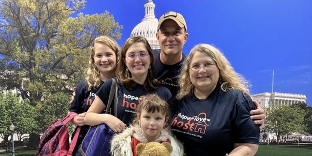 The Bradshaw family meet Katya for the first time at Dulles Airport last December. (Courtesy: The Bradshaw Family.)