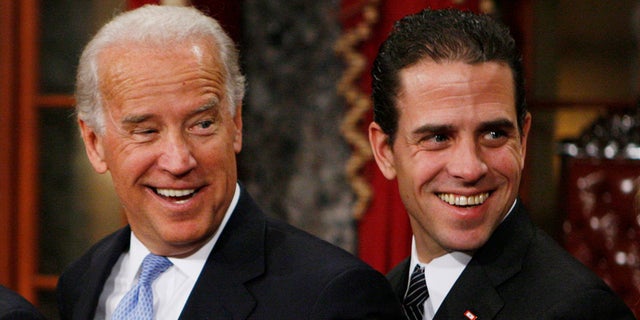 Then Vice President-elect, Sen. Joe Biden, D-Del., left, stands with his son Hunter during a re-enactment of the Senate oath ceremony in the Old Senate Chamber on Capitol Hill in Washington on Jan. 6, 2009.