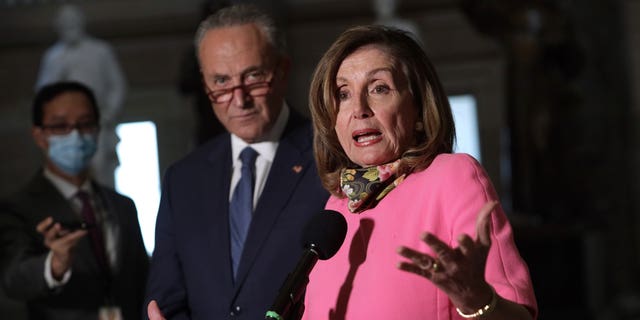 Democrats House Speaker Nancy Pelosi and Senate Majority Leader Chuck Schumer speak at an event. 