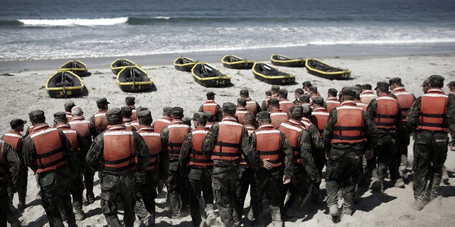 CORONADO, CA - AUGUST 13: A group of Navy SEAL trainees in August 2010 during Hell Week at a beach in Coronado, California.