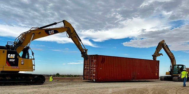 Construction begins to fill gaps in the border wall in Yuma, Arizona, on Friday, Aug. 12, 2022.