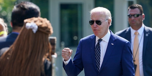 President Biden greets people after returning to the White House in Washington, Wednesday, Aug. 24, 2022.