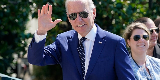 President Biden waves after returning to the White House in Washington, Wednesday, Aug. 24, 2022.